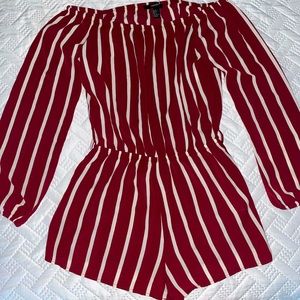 Off the shoulder short romper with long sleeves.